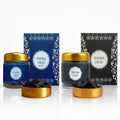 Tayba Blue and Tayba Black bakhoor jars with charcoal and lighter